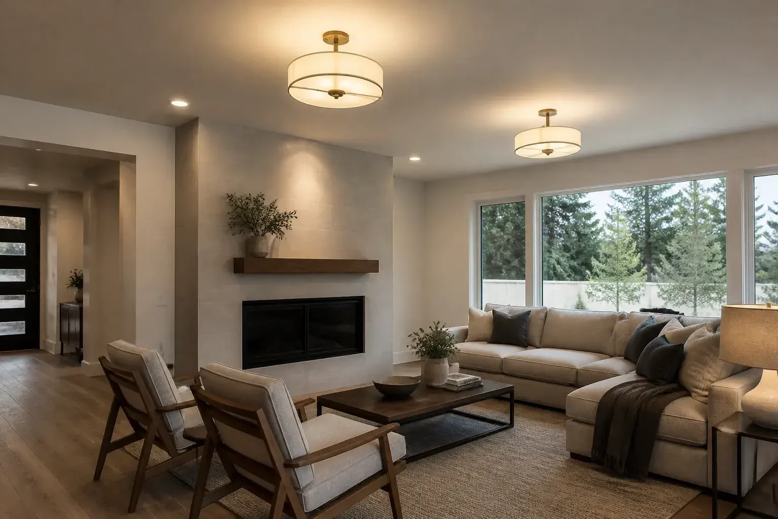 Finished living room with new ceiling lighting